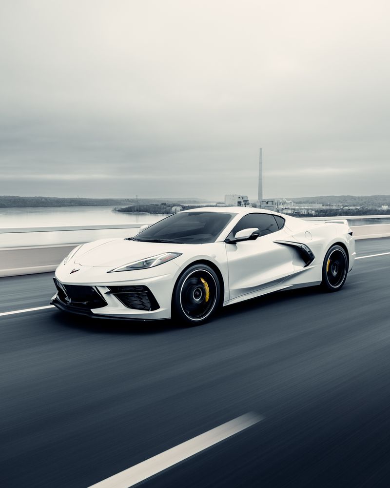 Rolling shot of a white Corvette
